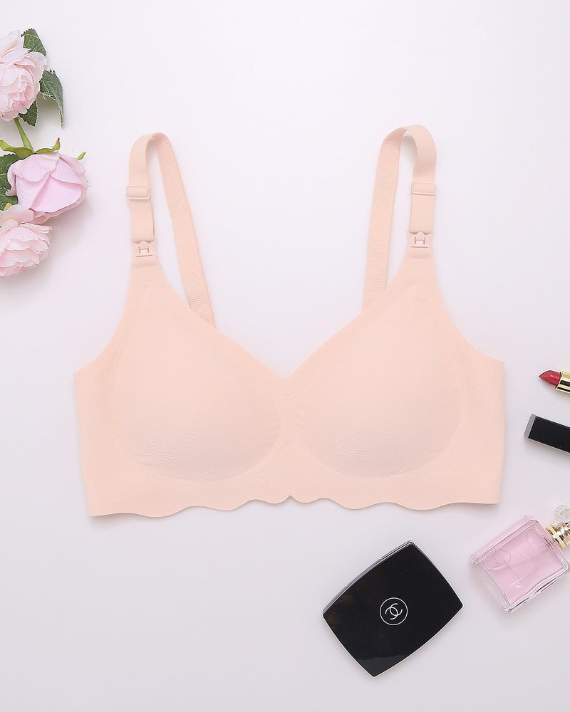 Peach seamless maternity bra with adjustable straps, ultra-comfortable for nursing mothers.