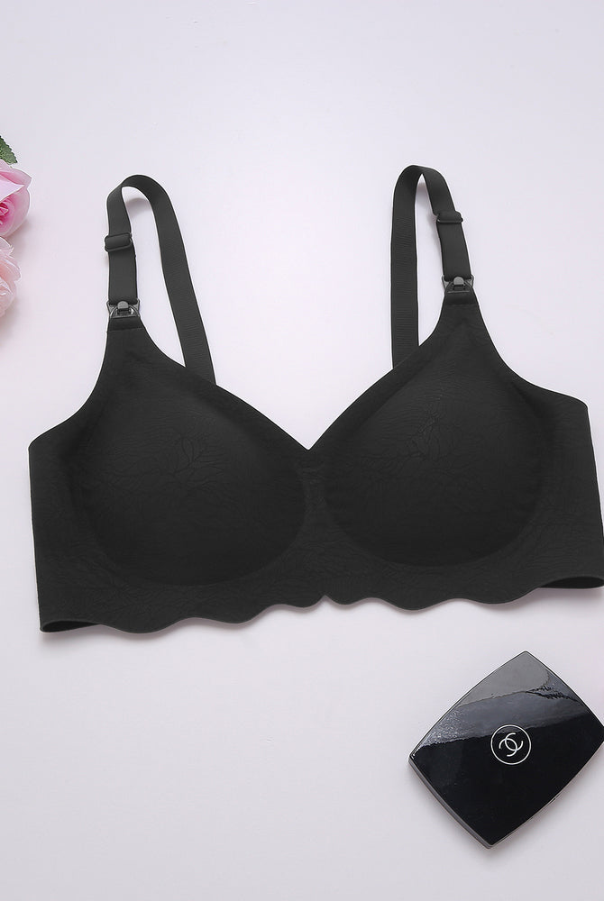 Black seamless maternity bra with adjustable straps. Comfortable & supportive design for nursing.
