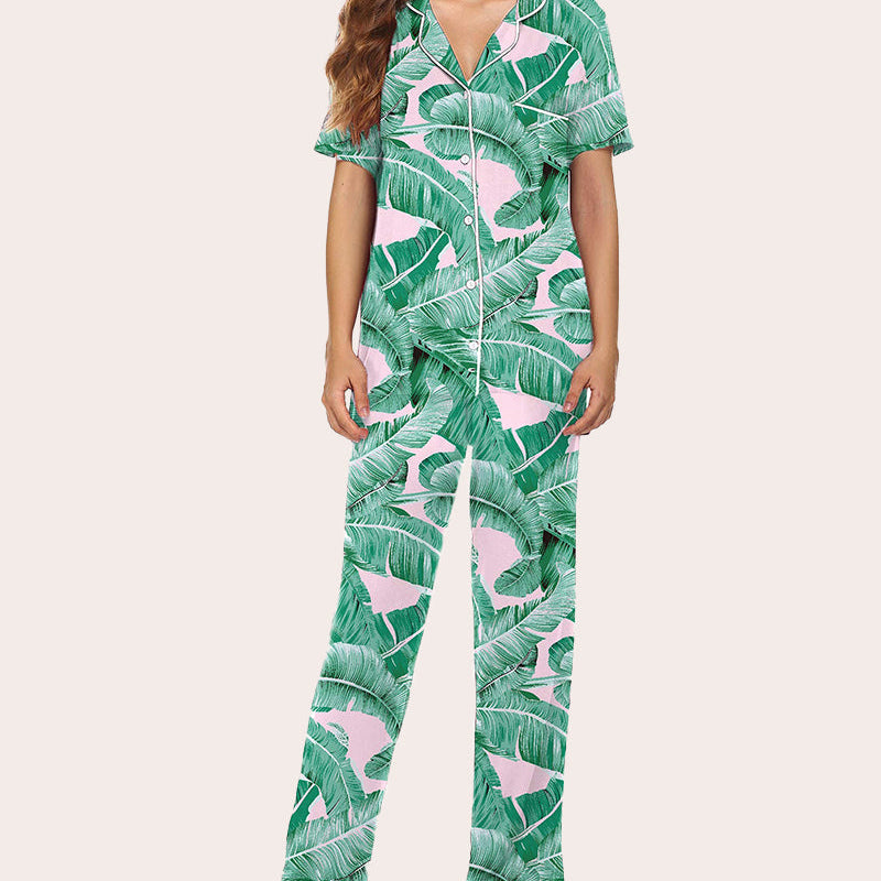 Green leaf print pajama set with button-down shirt and long pants. Comfortable sleepwear.
