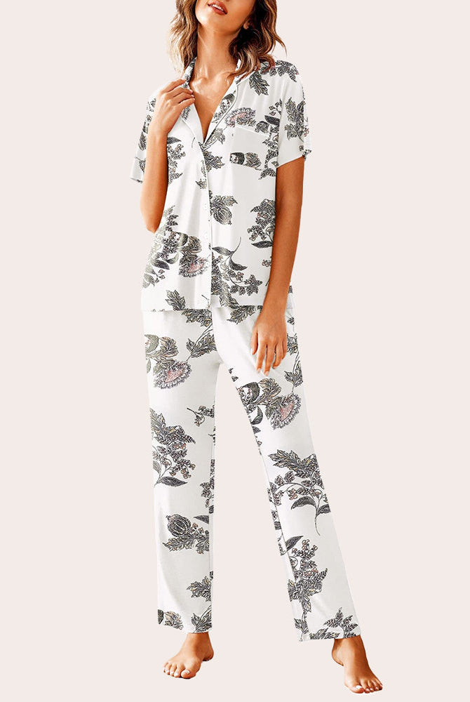 White floral pajamas set: Short-sleeved shirt and long pants. Comfortable sleepwear.