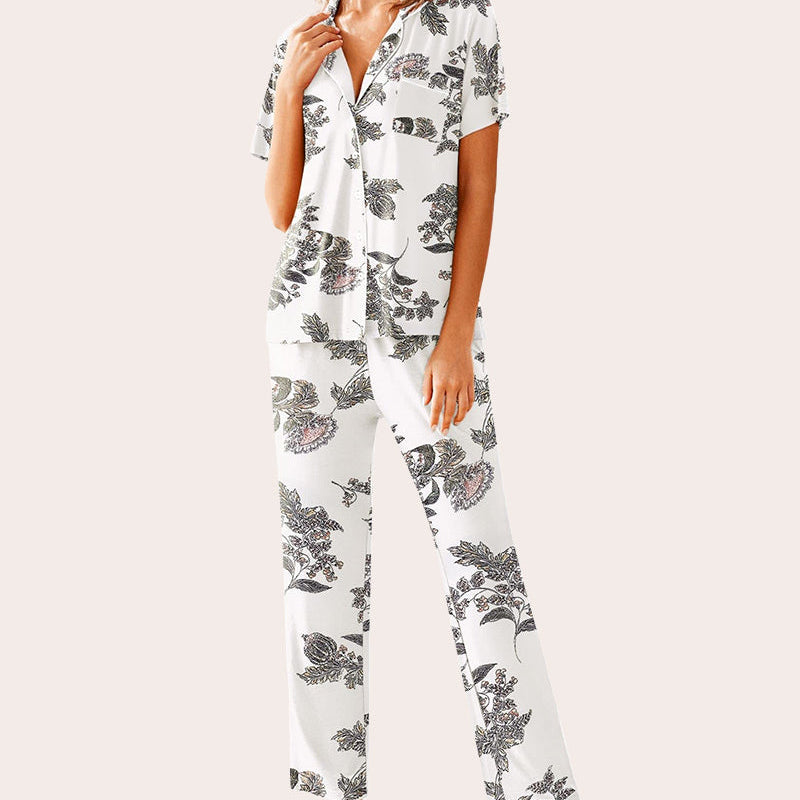 White floral pajamas set: Short-sleeved shirt and long pants. Comfortable sleepwear.