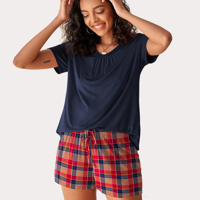 Navy short sleeve pajama set with red plaid shorts. Soft and comfortable women's sleepwear.