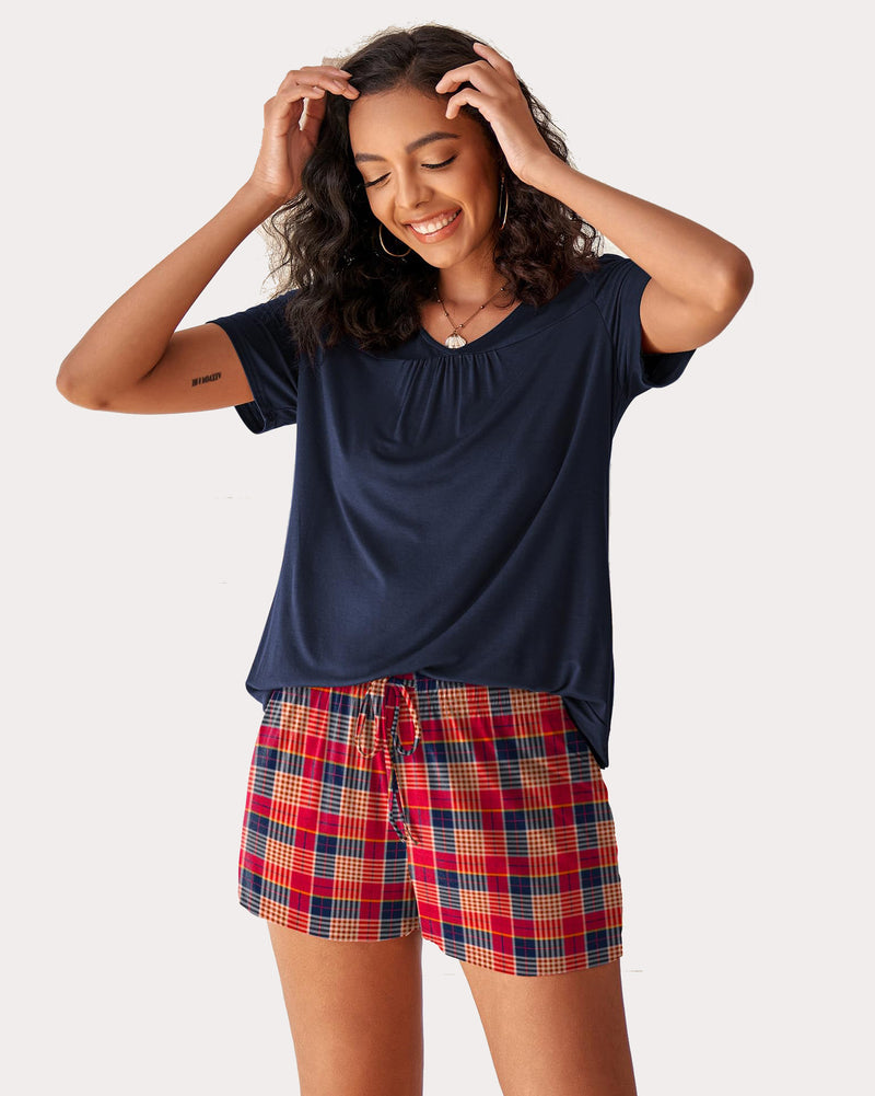 Women's navy V-neck top with red plaid shorts pajama set. Comfortable rayon sleepwear.