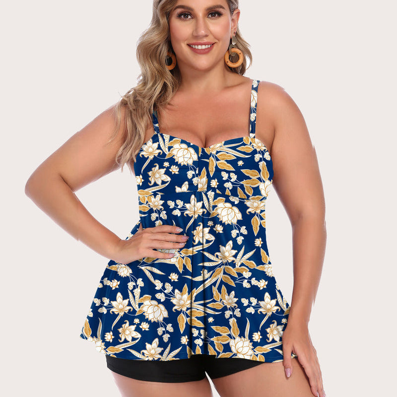 Women's floral tankini swimsuit set, adjustable straps, black shorts. Stylish swimwear for sun.