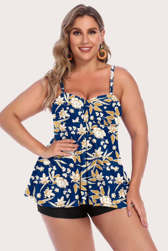 Floral tankini set with adjustable straps and black shorts. Retro swimwear for sun protection.