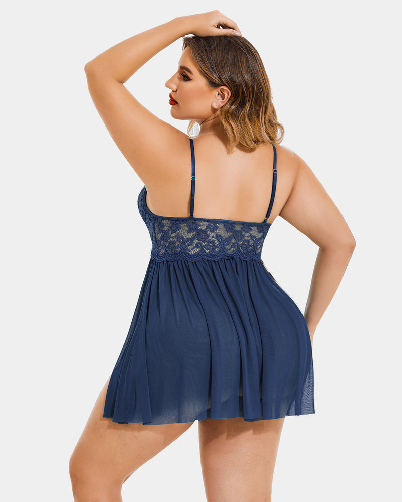 Plus size navy blue babydoll lingerie with lace cups, mesh side slit, and adjustable straps.