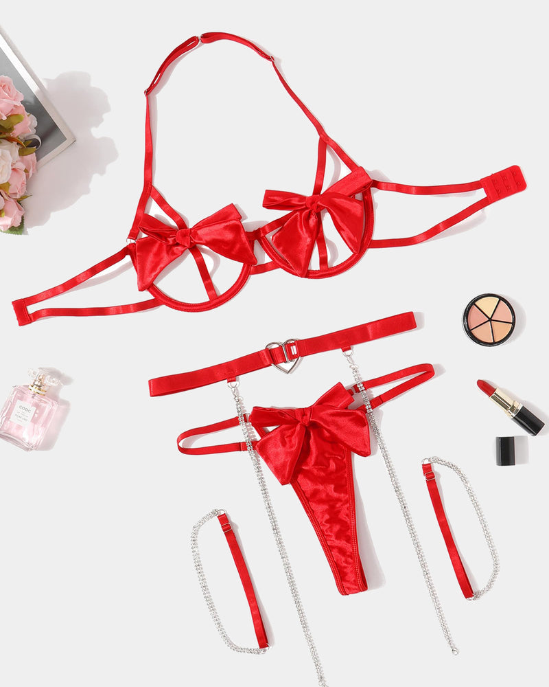 Red satin bow lingerie set with underwire bra, heart cutout garter belt, chain detail and g-string