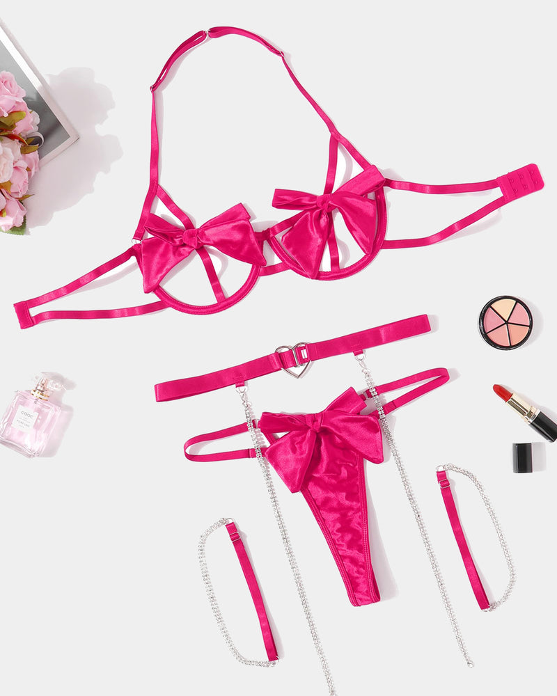 Hot pink bow lingerie set with underwire bra, heart garter, chain and g-string details.