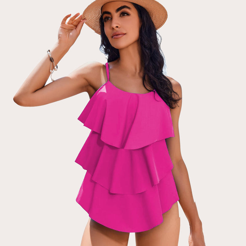 Women's hot pink ruffle tankini swimsuit with adjustable straps. Beachwear with layered design.