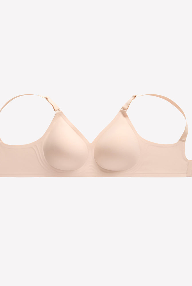Beige wireless push-up bra, V-neck, full coverage, seamless smoothing, adjustable straps, comfortable.