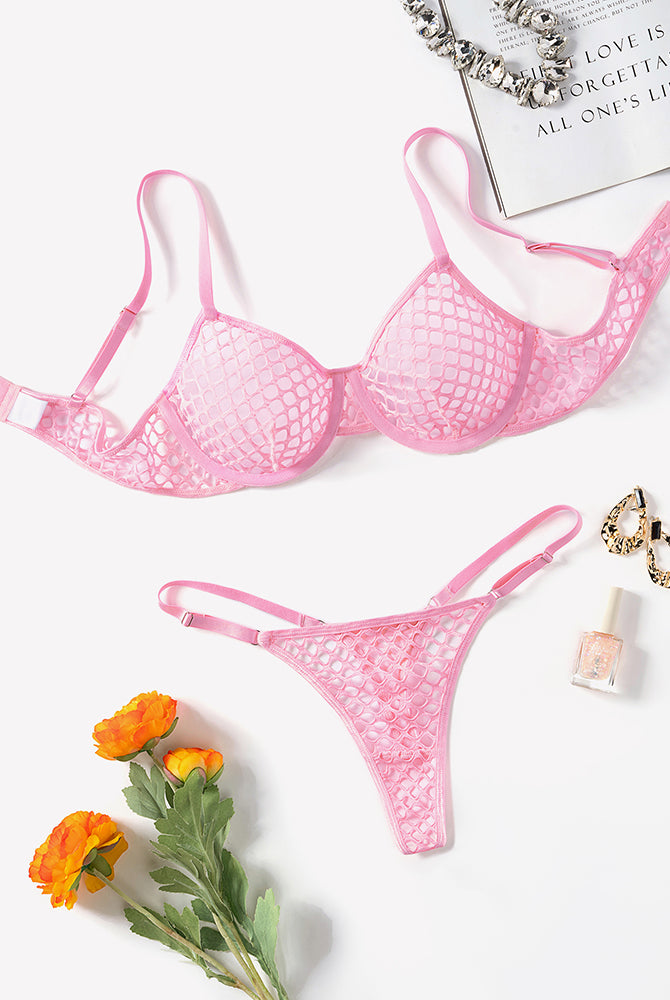 Pink fishnet hollow-out push-up bra and thong set laid flat