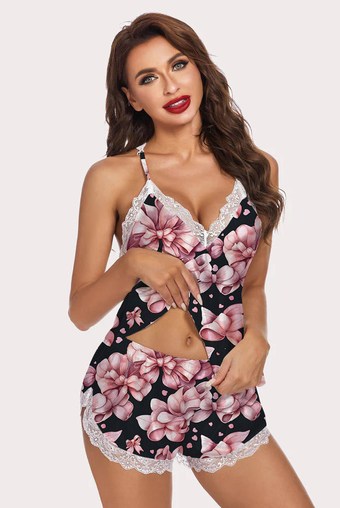 Pink floral two-piece pajama set with lace trim, perfect for a comfortable and stylish night.