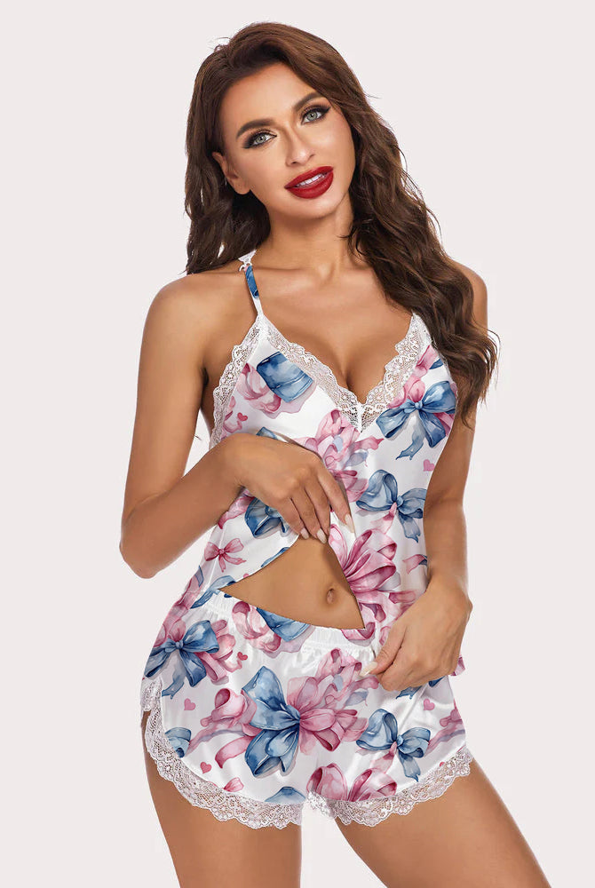 XL Pink Bow Pajamas Set. Satin two-piece set with lace trim, featuring a floral bow pattern.