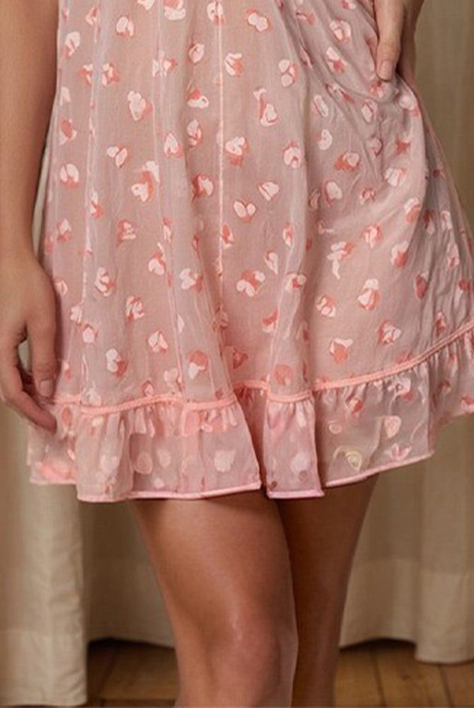 Pink sleep dress hem with heart print and gathered ruffle edging, short length
