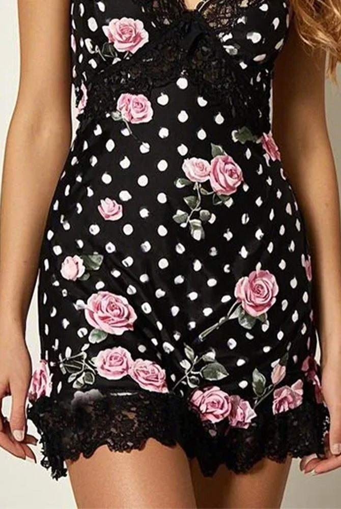 Black lace sleep dress with scalloped hem and pink rose print over white polka dots.