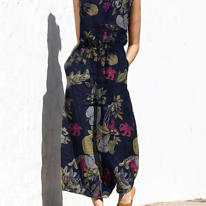 Navy floral leaf print sleeveless wide-leg long jumpsuit with elastic waist and crew neck