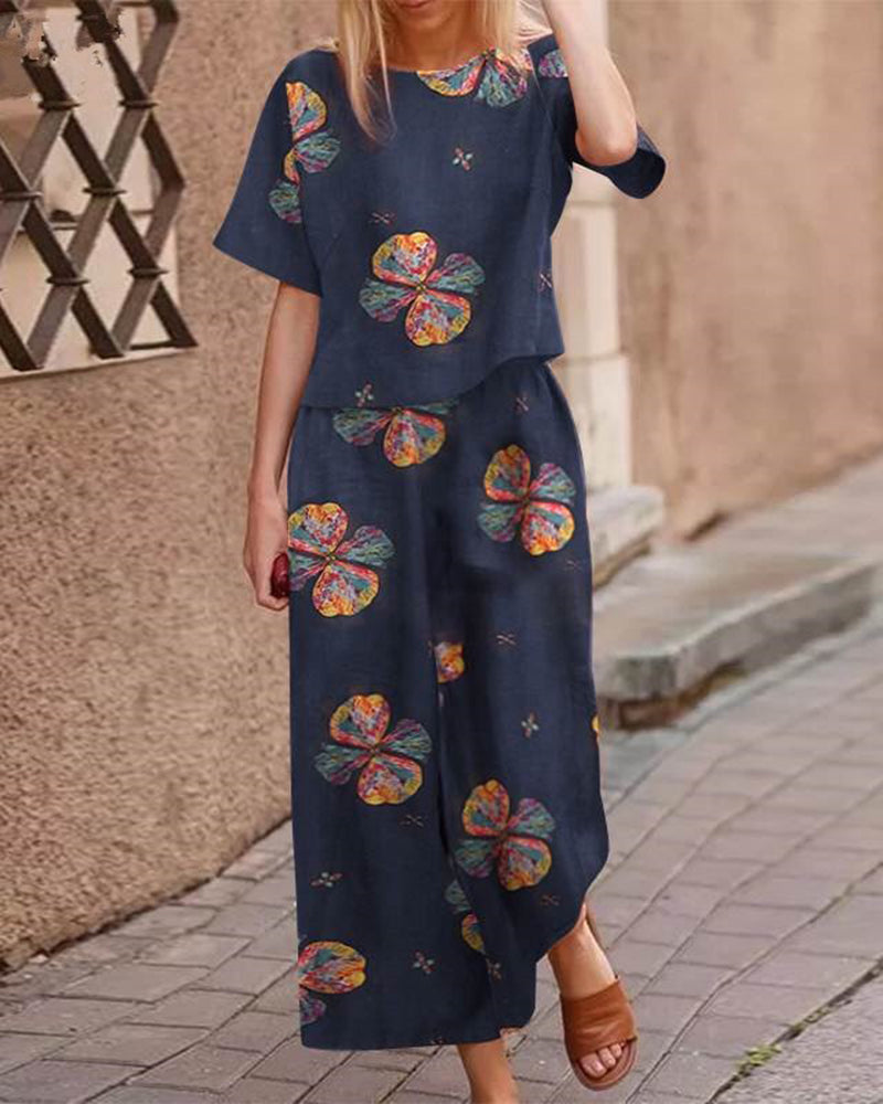 Navy blue floral linen two-piece set for women, casual style. Loose fit top and wide leg pants.