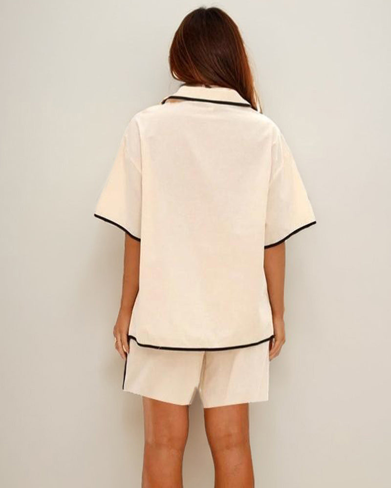 Cream linen shorts and shirt pajama set with black trim, perfect for home wear.