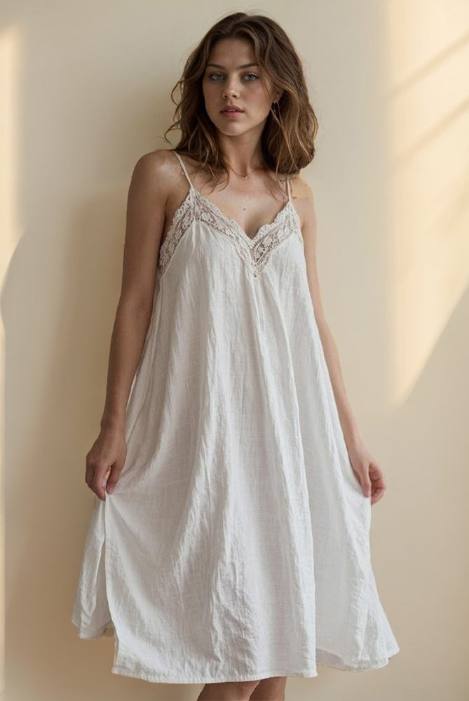 White cotton linen nightdress with lace detailing, perfect for a comfortable and stylish night.