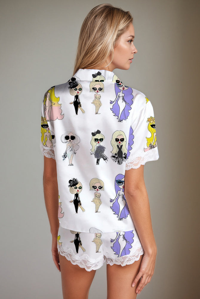 Women's white satin pajama set with doll print, short sleeves, shorts, and lace trim