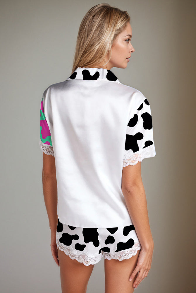 Cow print satin pajama set for women. White silk short-sleeved shirt and shorts with lace.