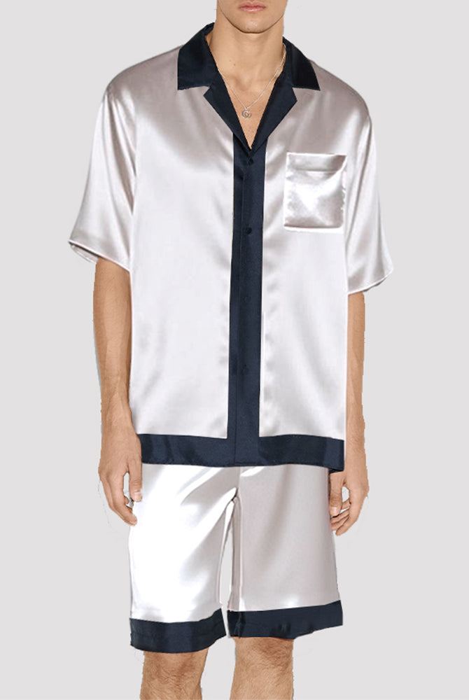 Men's white satin pajama set with navy trim, silk fabric, short-sleeved shirt and shorts