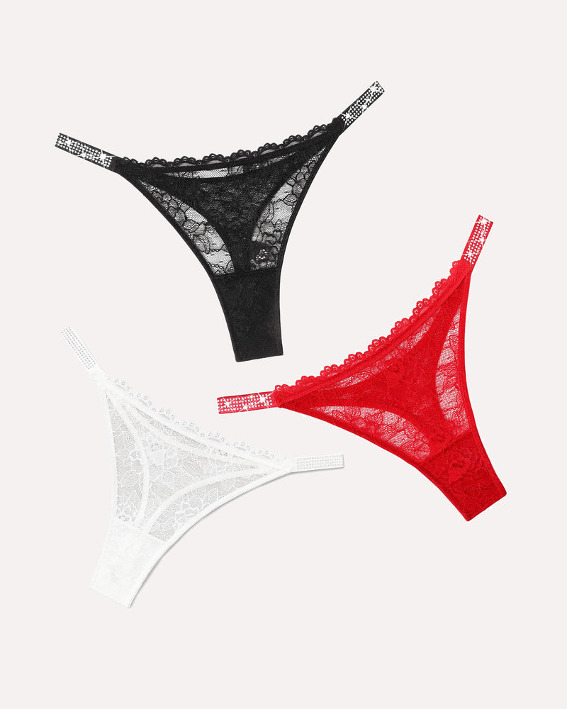 Lace thongs with rhinestone straps in black, red, and white colors. Sexy lingerie for women.