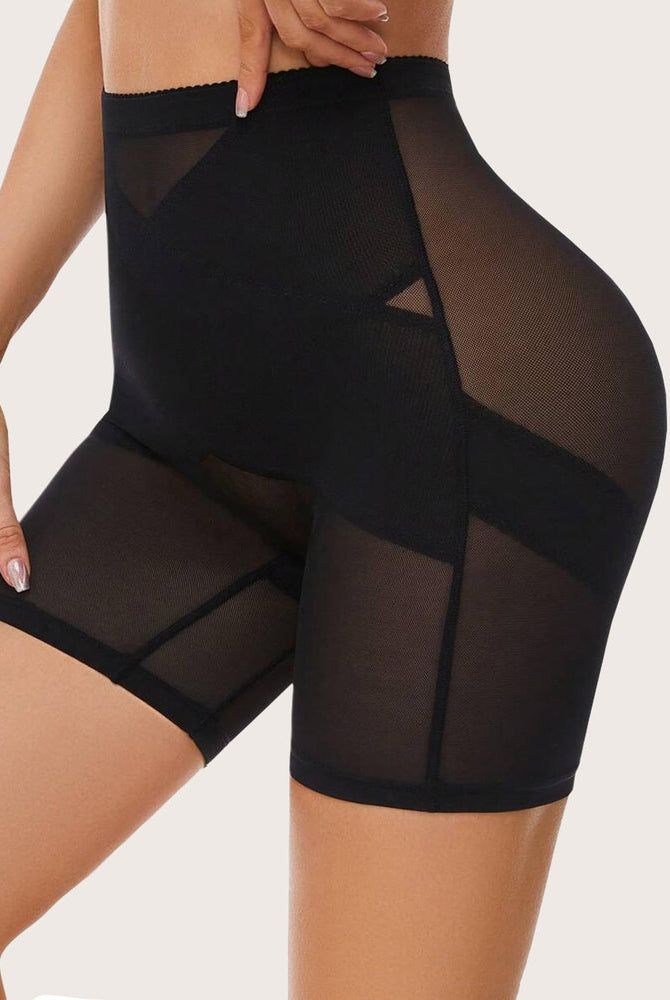 Black shapewear shorts: high-waisted design with tummy control, butt lift, smooth silhouette.