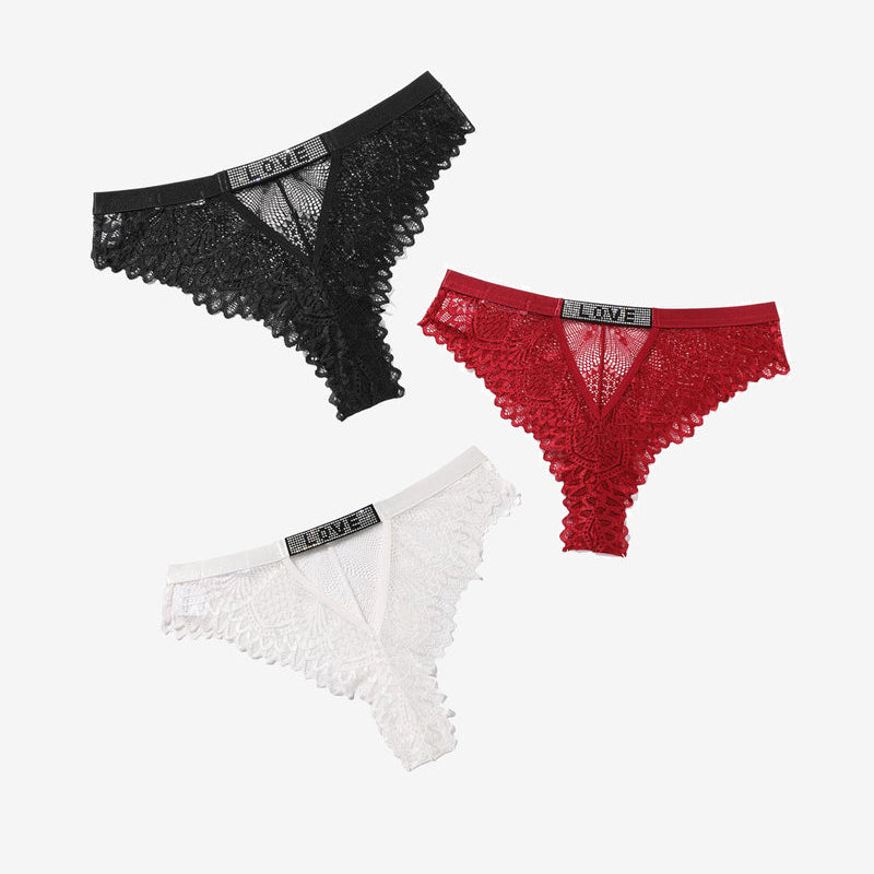 Lace thong panties with rhinestone 'LOVE' detail in black, red, and white. Soft, elegant design.