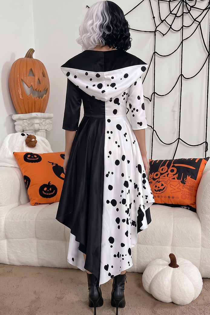 Black and white harlequin fit-and-flare dress, back view with flowing draped skirt