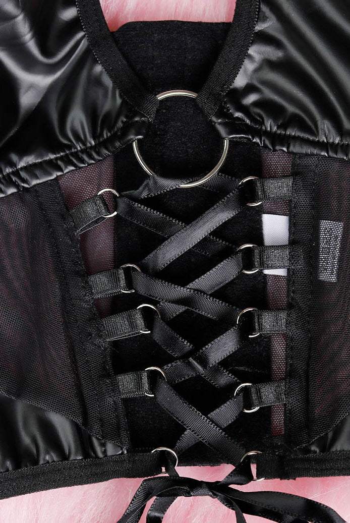Close-up of black halter lingerie top with ring clasp and lace-up strap front
