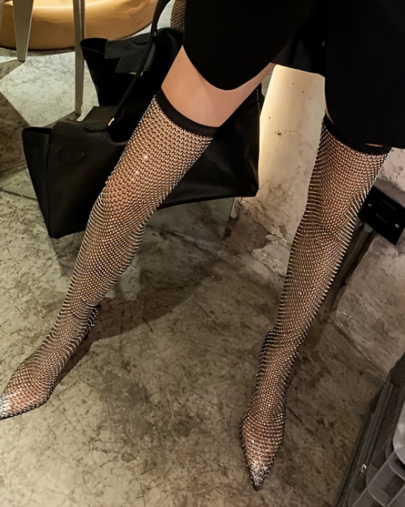 Black rhinestone fishnet over-the-knee stiletto boots, side view with tall heel