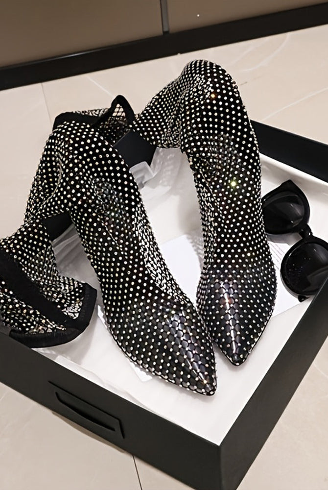 Black rhinestone fishnet over-the-knee stiletto boots with pointed toes