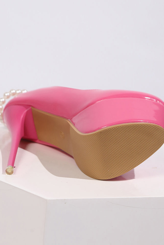 Pink patent platform pump heel with pearl anklet chain detail