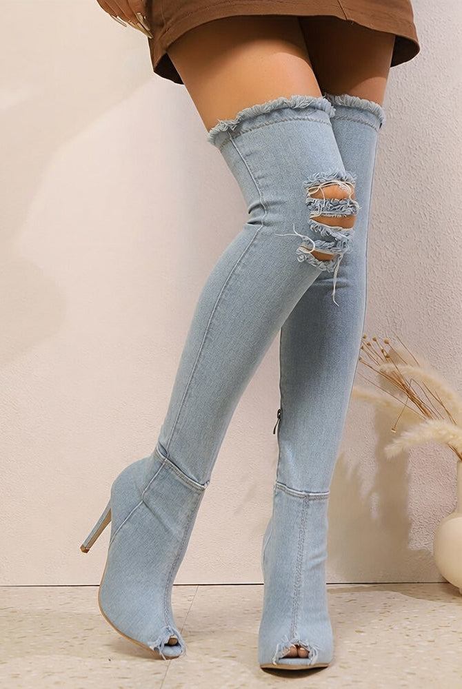 Light blue distressed denim over-the-knee stiletto boots with frayed panels