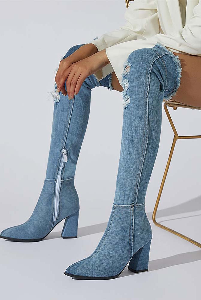 Over-the-knee stiletto boots in light blue distressed denim, pointed toe, tall heel, side zip.