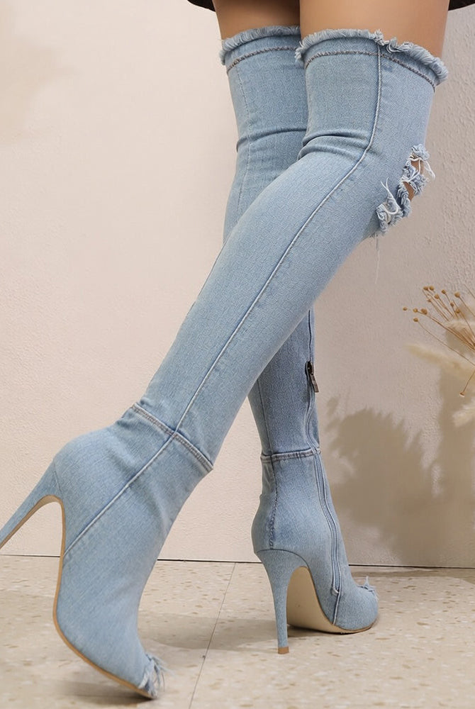Light blue distressed denim over-the-knee stiletto boots, side view