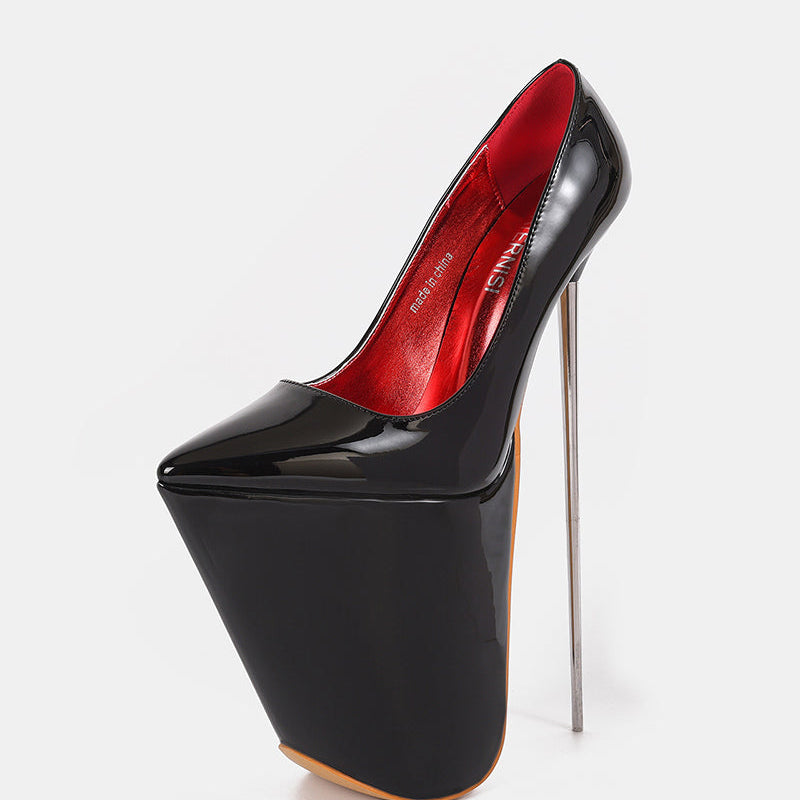 Black patent platform stiletto pump with red interior lining and slender high heel
