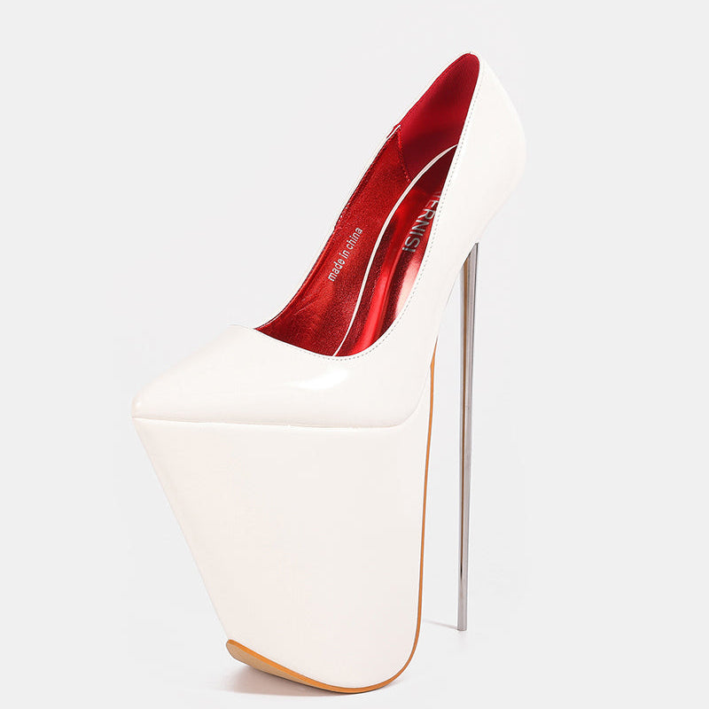 White patent platform stiletto pump with pointed toe and tall thin stiletto heel