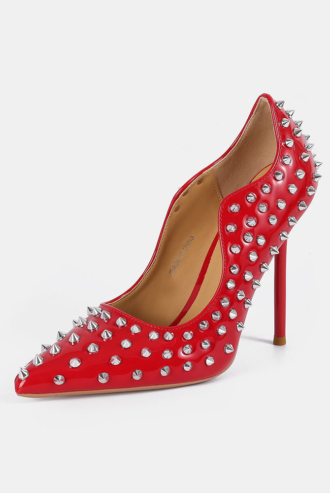 Red patent pointed-toe stiletto pump with silver spike studs and high heel