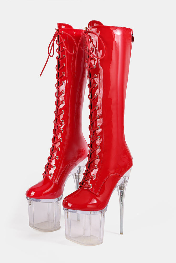 Red knee-high patent lace-up stiletto boots with clear platform heel