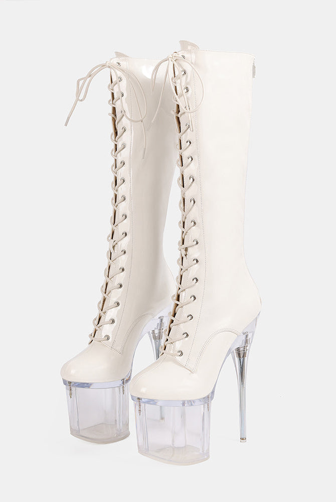 White knee-high patent lace-up stiletto boots with clear platform heel