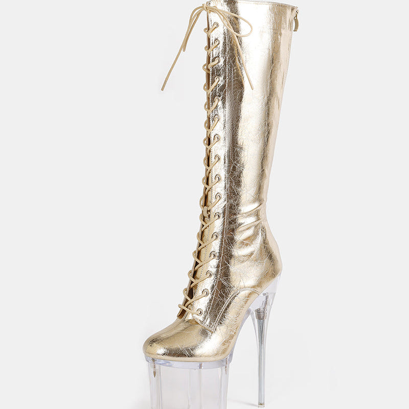 Gold metallic knee-high stiletto boot with lace-up front and clear platform heel