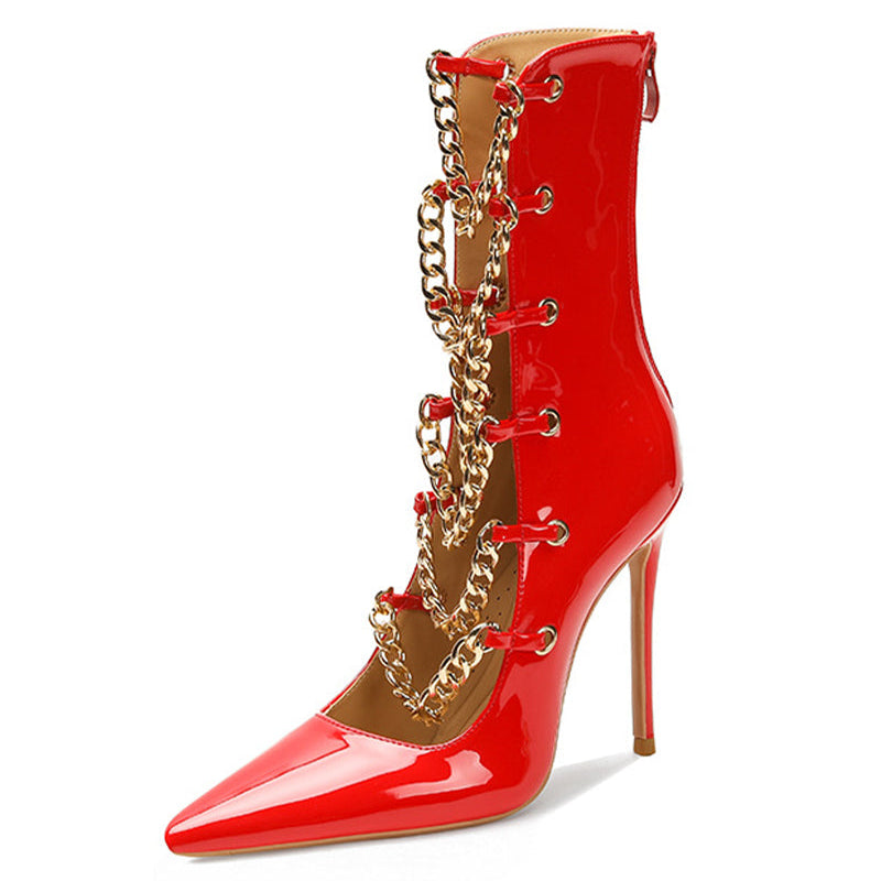 Red patent stiletto ankle boot with gold chain trim and pointed toe.