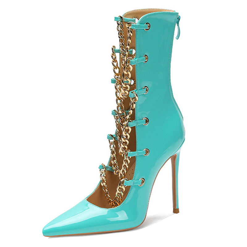 Sky blue patent stiletto ankle boot with gold chain trim and pointed toe.
