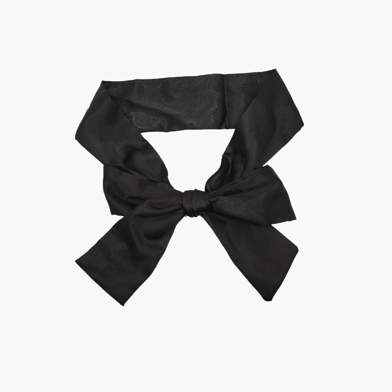 Black satin eye mask kit, adjustable for meditation, travel, or romantic use. Soft, elegant design.