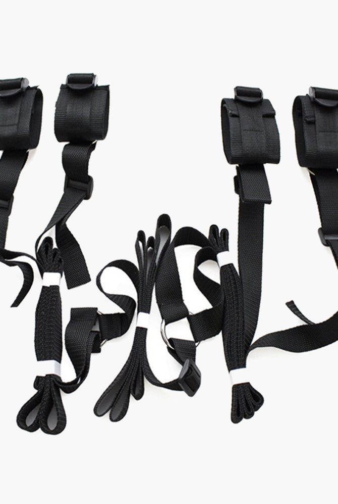 Black SM sex toy restraint band set with adjustable cuffs and straps for intimate exploration.