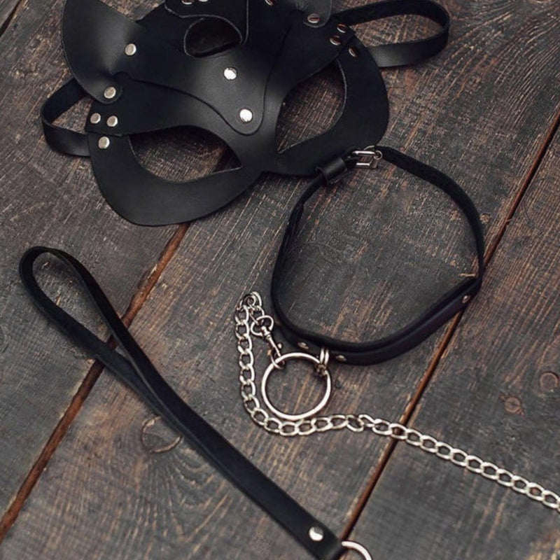Black leather cat mask with pointed ears and black leash with snap and chain