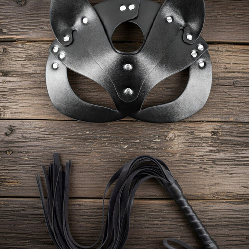 Black leather cat ear mask with eye cutouts and black braided leash