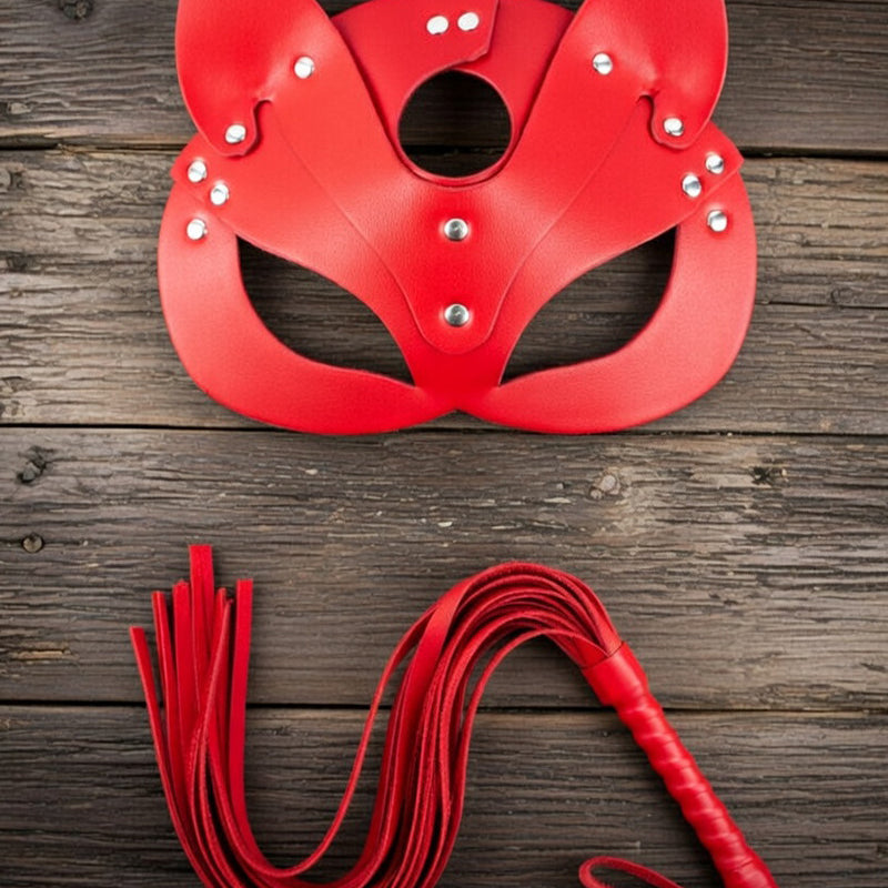 Red leather cat ear face mask with oval eye cutouts and red braided leash